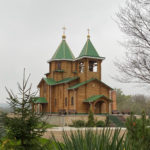 Wallpaper of a wooden church in Stroensy for WUXGA screens